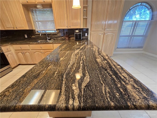 407 E Esperanza Ave, Mission, TX 78574 - kitchen featuring light tile patterned floors, tasteful backsplash, light brown cabinets, dark stone counters, and open shelves