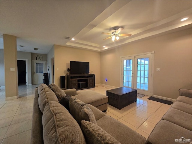 407 E Esperanza Ave, Mission, TX 78574 - living room with light tile patterned floors, a ceiling fan, a raised ceiling, recessed lighting, and french doors