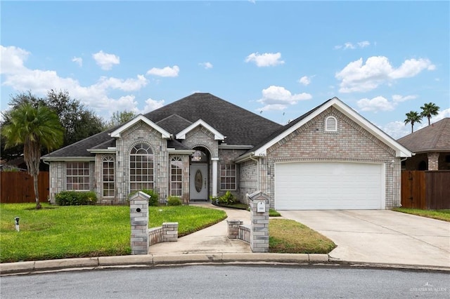 ranch-style home featuring a garage and a front yard