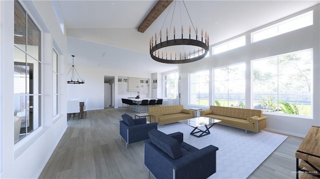 living area with high vaulted ceiling, wood finished floors, beam ceiling, and an inviting chandelier