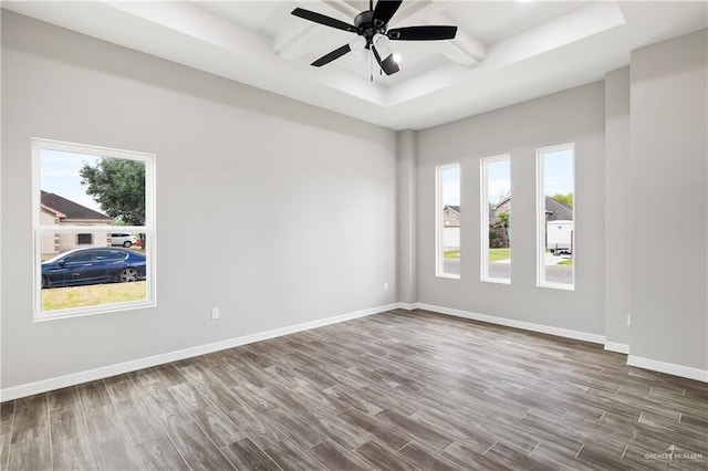 3303 Alcatraz St, Edinburg, TX 78542 - spare room with plenty of natural light, dark wood-style flooring, baseboards, a ceiling fan, and beam ceiling