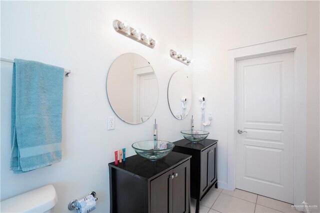 112 E Acapulco St E Unit 3, South Padre Island, TX 78597 - bathroom with tile patterned floors, vanity, and toilet