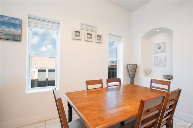 112 E Acapulco St E Unit 3, South Padre Island, TX 78597 - dining room with baseboards and light tile patterned flooring