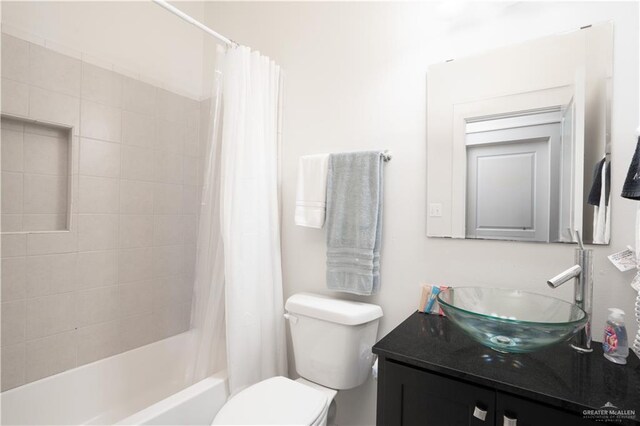 112 E Acapulco St E Unit 3, South Padre Island, TX 78597 - bathroom featuring vanity, shower / bathtub combination with curtain, and toilet
