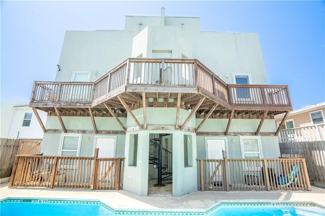 112 E Acapulco St E Unit 3, South Padre Island, TX 78597 - back of property with stucco siding and a balcony