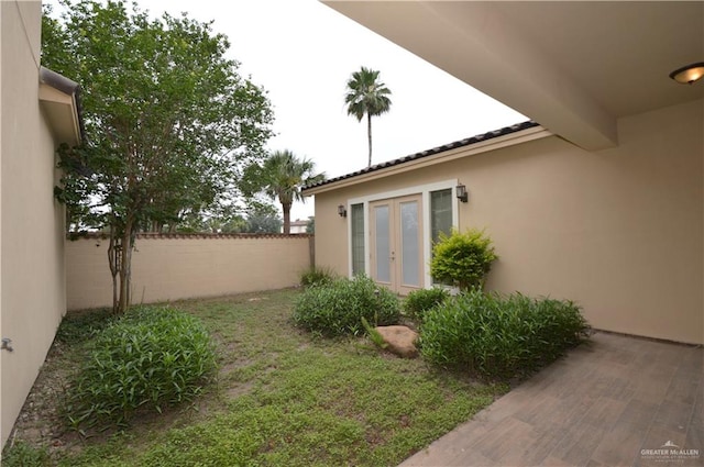 view of yard featuring french doors