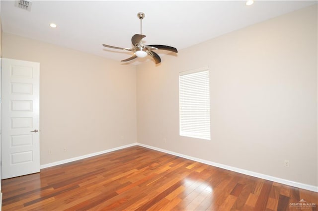 unfurnished room featuring hardwood / wood-style flooring and ceiling fan