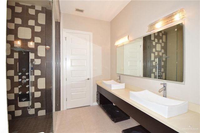 bathroom featuring tile patterned flooring, vanity, and an enclosed shower