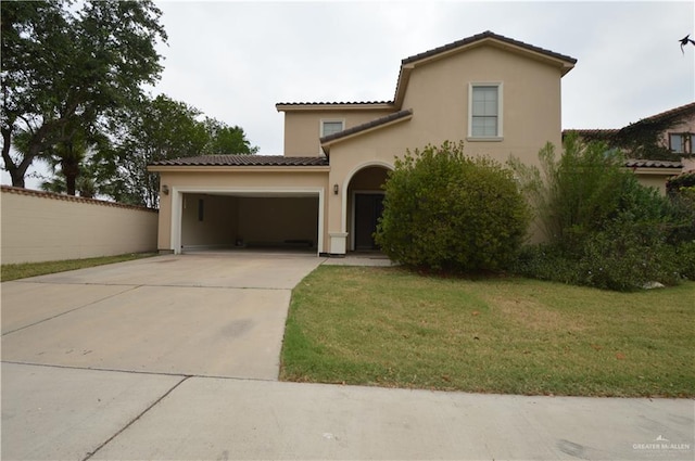 mediterranean / spanish-style house with a front lawn and a garage