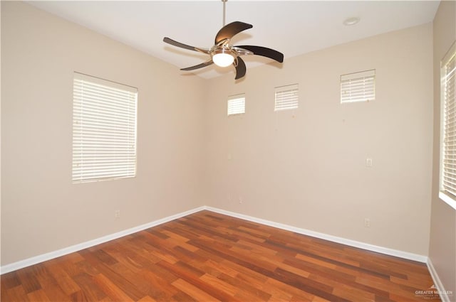 empty room featuring ceiling fan and wood-type flooring