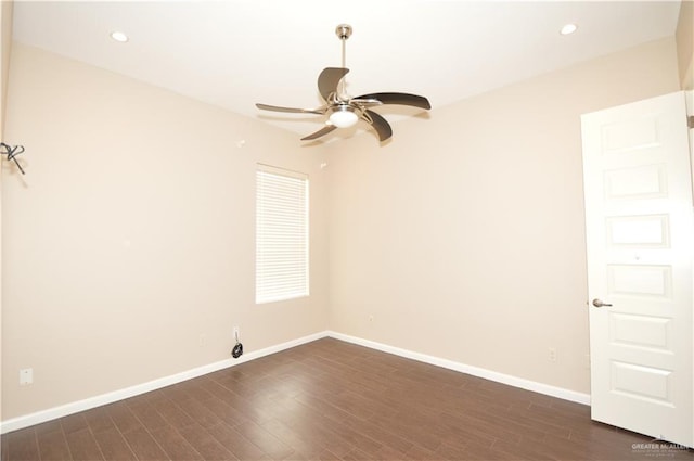 unfurnished room featuring ceiling fan and dark wood-type flooring