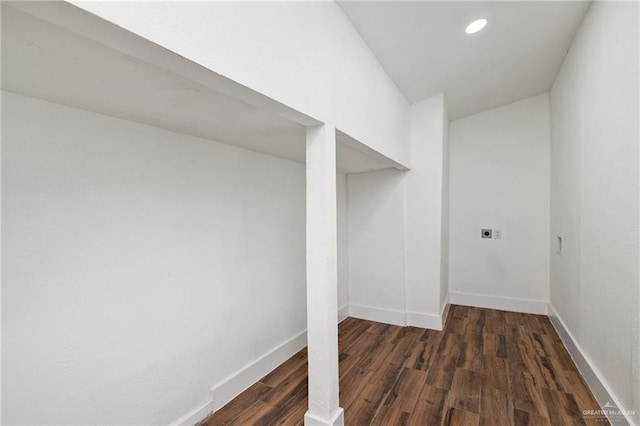 washroom featuring dark hardwood / wood-style floors and hookup for an electric dryer