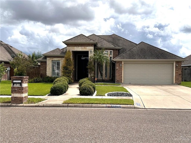 view of front facade with a garage and a front yard