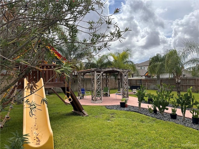 view of jungle gym featuring a lawn and a pergola