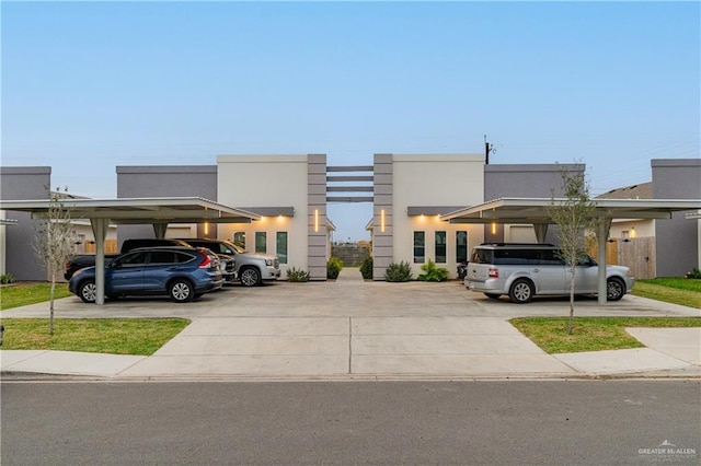 view of vehicle parking with a carport