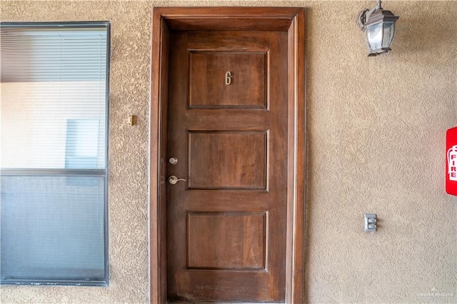 2815 Mimosa St Unit 6, Mission, TX 78574 - view of exterior entry featuring stucco siding