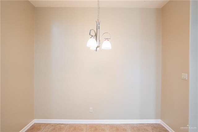 2815 Mimosa St Unit 6, Mission, TX 78574 - unfurnished room featuring a chandelier, baseboards, and light tile patterned flooring