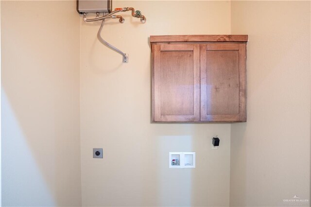 2815 Mimosa St Unit 6, Mission, TX 78574 - laundry area with hookup for an electric dryer, washer hookup, and cabinet space