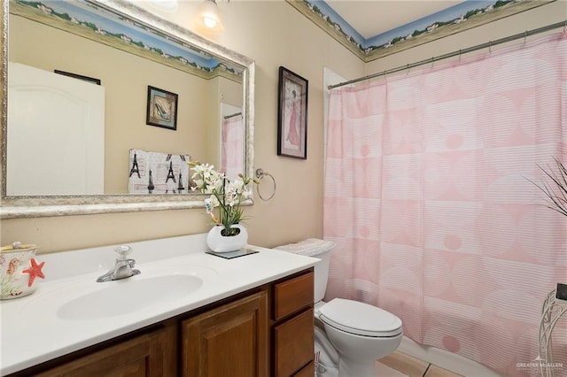 bathroom featuring tile patterned flooring, vanity, toilet, and a shower with curtain