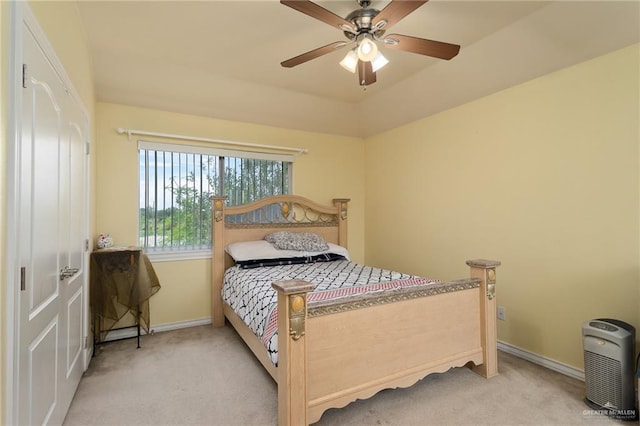 bedroom featuring ceiling fan and light colored carpet