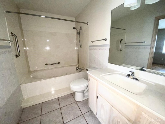 full bathroom featuring tile patterned flooring, toilet, vanity, tile walls, and tub / shower combination