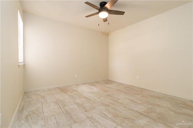 spare room with ceiling fan