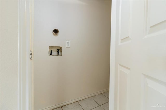 laundry area with washer hookup, hookup for an electric dryer, and light tile patterned floors