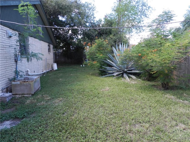 view of yard with central AC unit