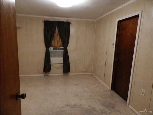 unfurnished room featuring crown molding