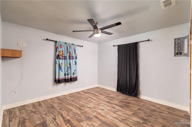 spare room with hardwood / wood-style floors and ceiling fan