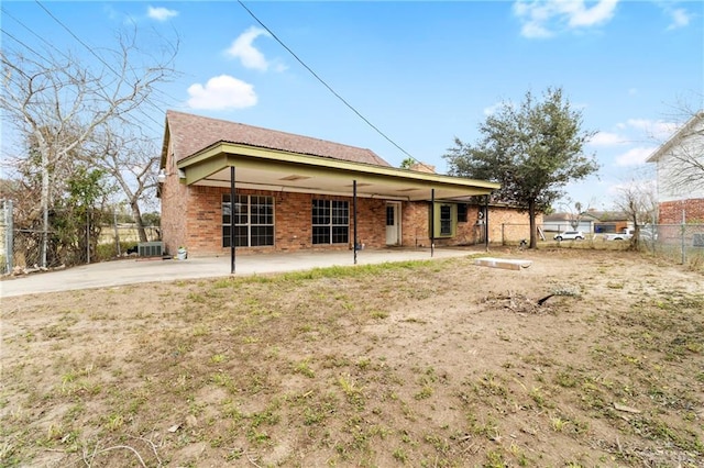 back of property featuring central air condition unit