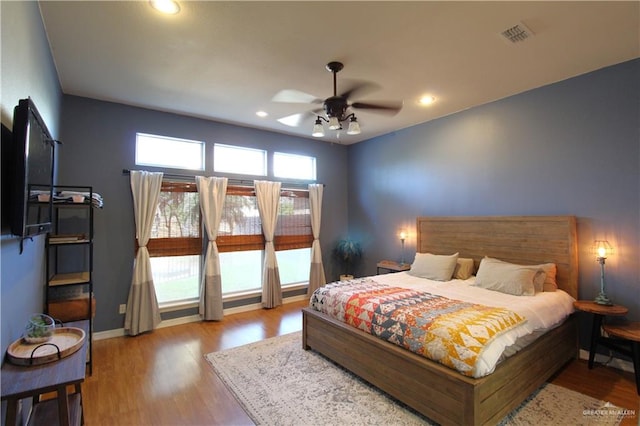 bedroom featuring ceiling fan and light wood-type flooring