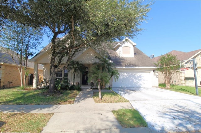 view of front of house featuring a front yard and a garage