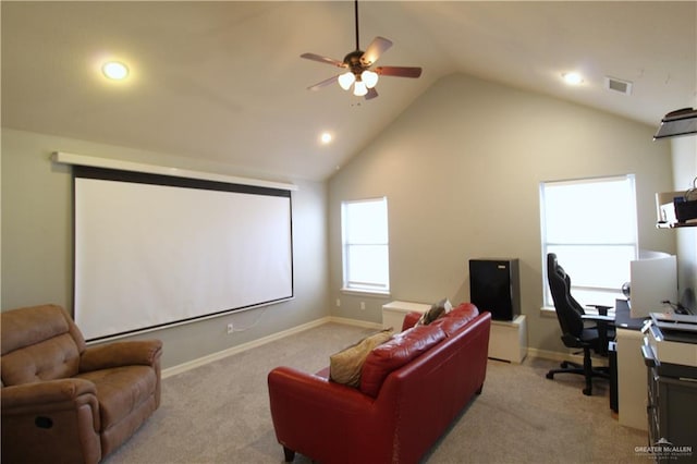 cinema room with light colored carpet, high vaulted ceiling, and ceiling fan