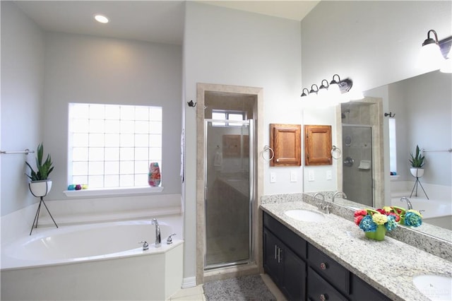 bathroom featuring tile patterned flooring, vanity, and independent shower and bath