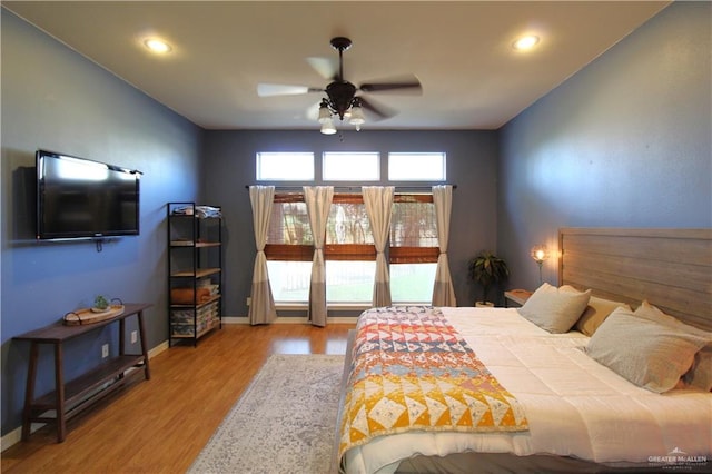 bedroom featuring ceiling fan and hardwood / wood-style flooring