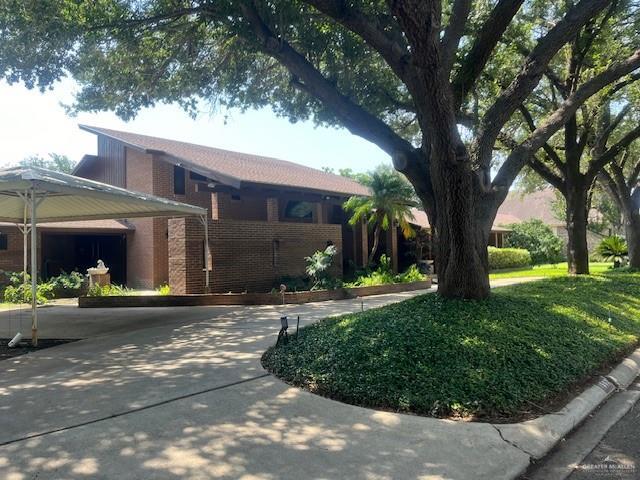 view of front facade with a front yard and a garage