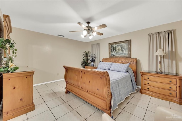 bedroom featuring light tile patterned flooring and ceiling fan