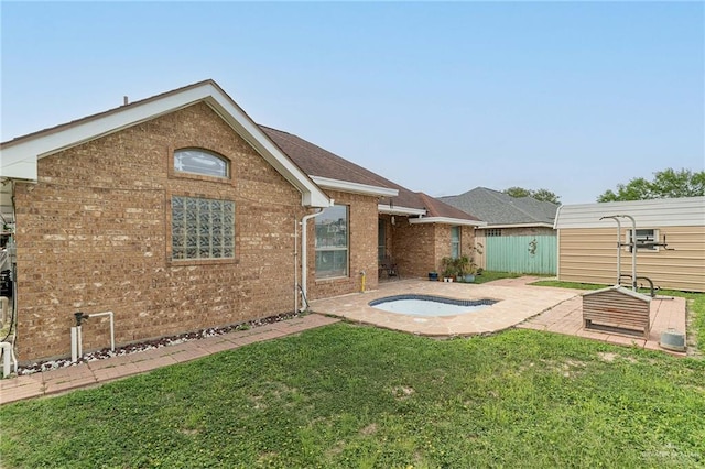 607 Via Cantera Dr, San Juan, TX 78589 - rear view of house with brick siding and a patio