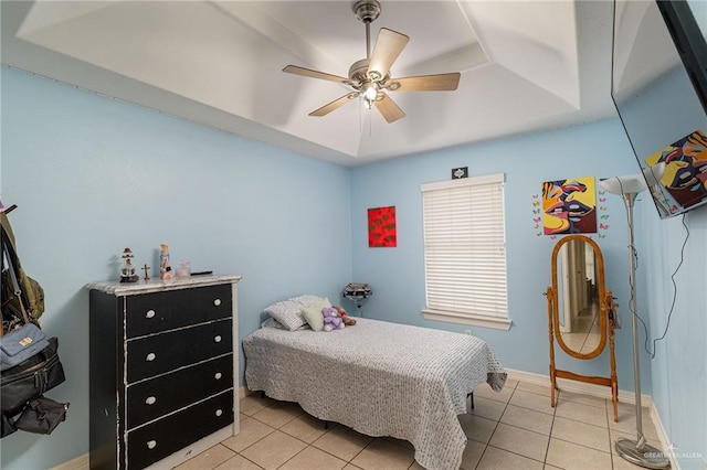 607 Via Cantera Dr, San Juan, TX 78589 - bedroom with light tile patterned floors, a raised ceiling, ceiling fan, and baseboards