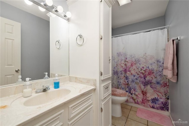 bathroom with tile patterned flooring, vanity, toilet, and a shower with curtain