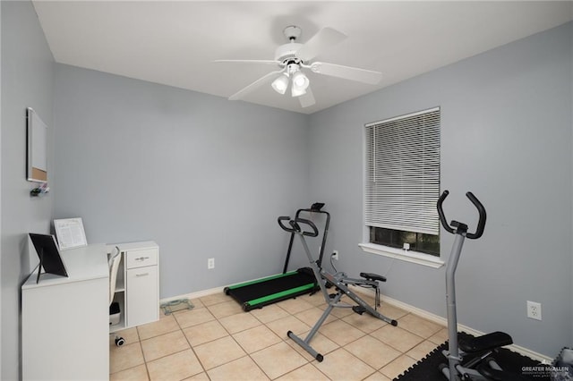 workout room with ceiling fan and light tile patterned flooring