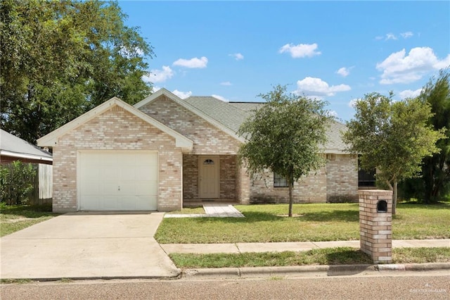 view of front of house featuring a front lawn and a garage