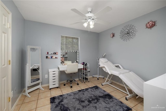 office area with ceiling fan and light tile patterned flooring