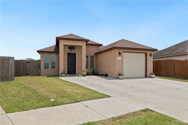 9713 Alexis Ave, Harlingen, TX 78552 - view of front facade with brick siding, concrete driveway, a garage, and roof with shingles