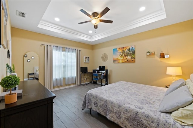 9713 Alexis Ave, Harlingen, TX 78552 - bedroom with a raised ceiling, wood finished floors, an office area, recessed lighting, and a ceiling fan