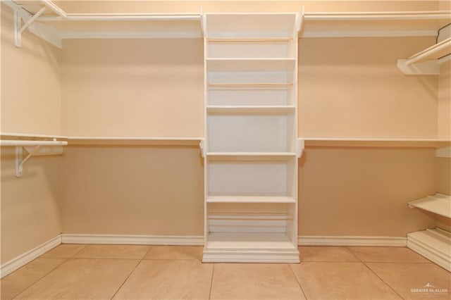 walk in closet featuring tile patterned flooring