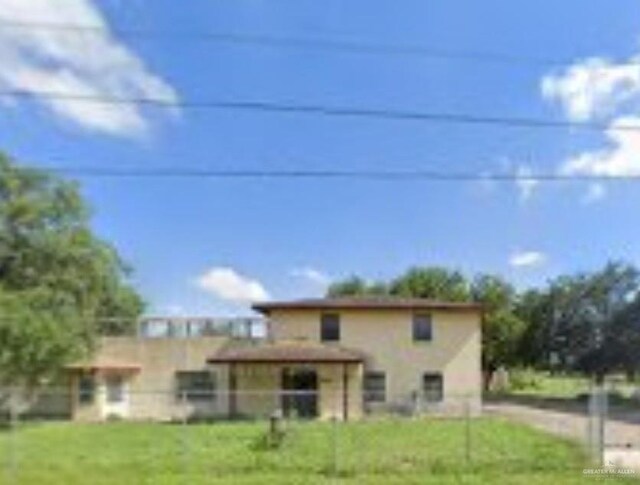 566 W Palma Vista Dr, Palmview, TX 78572 - front facade featuring a front lawn
