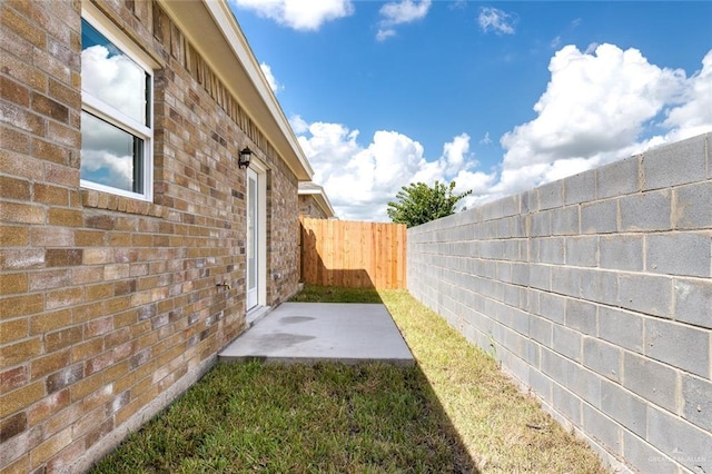 view of yard featuring a fenced backyard and a patio