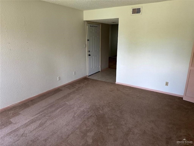 2901 Central Blvd Unit 807, Brownsville, TX 78520 - unfurnished room featuring light carpet, baseboards, and a textured ceiling